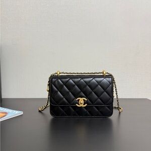CHANEL Black Quilted Leather Shoulder Bag with Gold Chain and CC Logo